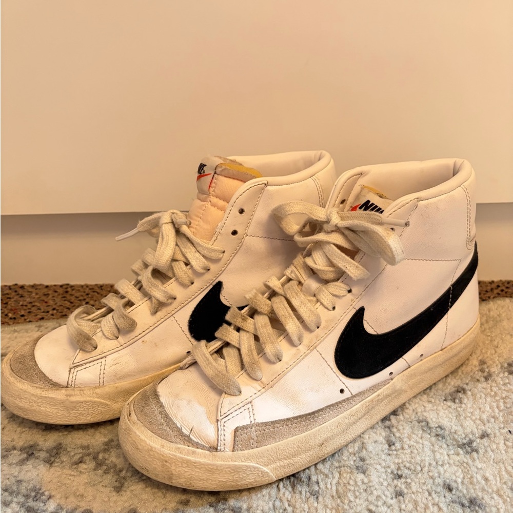 Nike White High-Top Sneakers with Black Swoosh